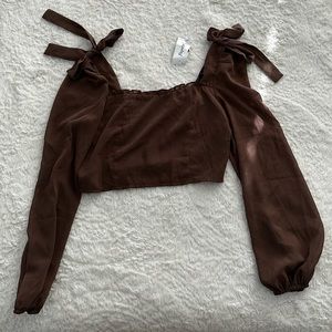 brown papaya cropped long sleeve blouse with bows on the sleeves